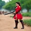 Placeholder: Mahima Chaudhary wearing 18th century red military uniform. curvy body. hair in ponytail. thick thighs. wearing booty shorts. wearing knee high boots. she is kneeling and hiding in trench. she is holding a musket gun. she is ready to fire gun. location is battlefield.