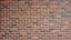 Placeholder: A brick wall with a black and brown theme