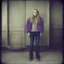 Placeholder: Dakota fanning, hippie girl, jeans, purple fur, in a liminal empty room, old autochrome