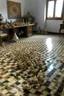 Placeholder: a house of sea shells and on the floor is a huge chess board