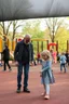 Placeholder: a creepy small skinny 40 year old dad in the playground with his young 3 year old daughter with blonde hair playing on the playground but the dad is checking out all the other kids curvy mums . there are many kids playing on the playground