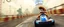Placeholder: nico belic in donkey kong bowling stage racing, motion blur, weird creatures, mini racing kart, fences and hills, pits and pendulums, and cranes and squids, fog, smoke, oil slick, spies, gta 4 world