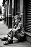 Placeholder: A boy sitting on the sidewalk, smoking a cigarette and wearing sandals