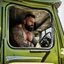 Placeholder: photography of a truck beefy driver sleeping in truck, inside cab,, sweaty , massive with tattoos and short beard, Romanian, muscular and manly chest, shorts, , seen from below