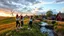 Placeholder: a group of young ladies in sports pants and blouse are dancing to camera in village over high grassy hills,a small fall and river and wild flowers at river sides, trees houses ,next to Ripe wheat ready for harvest farm,windmill ,a pretty train is arriving to station,a few village local shops ,cloudy sun set sky