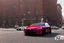 Placeholder: A Tesla 'Model Y' is parked, near the Flatiron Building in Manhattan. (CINEMATIC, WIDE ANGLE LENS, PHOTO REAL)