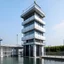 Placeholder: a two-storey water rescue station with a 12-meter high tower is white with black stripes, the ground floor area is 100 squares, with a garage on the ground floor