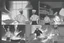 Placeholder: black and white storyboard, 3 chefs, scattered throughout the kitchen cooking, frying, cutting