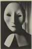 Placeholder: a black and white photograph in the style of man ray, the photograph is of a scary ghost mask