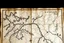 Placeholder: a scan of an ancient Cree road map of a fictional place, printed black and white but has since been stained and weathered