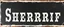 Placeholder: fill composition with large and wide hand painted old western sign that reads: "SHERRIF" white on black with inset white stripe aged paint sanserif