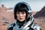 Placeholder: Photo of a Sci-fi woman, with black hair, wearing a silver and black spacesuit looking like an android, on an alien planet