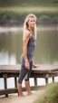 Placeholder: anorexic beautiful 19 year old woman, total shot, grey capri leggins, triathlon top, blonde surfer hair, blurred beach background