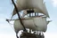 Placeholder: front view of a wooden ship with a spider figurehead