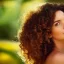 Placeholder: **The embodiment of summer is a beautiful 30-year-old woman with curly hair, exotic birds fly out of her hair, the face is beautiful, the atmosphere of the scene is uplifting and dynamic, Summer cinematic, the colors are green dark, red, orange and touches of blue