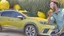 Placeholder: guy arguing on phone next to kia sportage covered with lemons