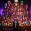 Placeholder: a picture of a dark, comedic, anatomically correct wall of colorful tightly packed skulls of varying sizes and expressions, photo realistic, insanely meticulous, highly detailed, part of a collection of bones on display, 64k, dystopian, vray