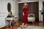 Placeholder: very beautiful sexy lady with beautful dark red midi skirt and blouse standing in a luxury bedroom with high heels next to makeup desk looking to camera