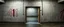 Placeholder: background of wall(wet textured concrete, gray, old, cracked, stained) from underground parking, hong kong style, a large number 41 painted on left(old paint), at middle is an open door frame to a asian rave club