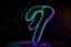 Placeholder: black background, outlines of a holographic question mark drawn from thin neon-coloured glowing lines