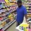 Placeholder: a man paying his items in a walmart, detailed photo