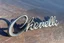 Placeholder: "Chevelle" metal nameplate 3d metal with shadow, on top of scratched wood surface
