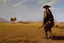 Placeholder: man with the gun walking among dry field by andrea del sarto