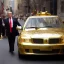 Placeholder: Donald Trump Driving a Gold Car