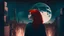 Placeholder: A very large film shot of a young Arab man contemplating looking at the moon in a city full of lights and a singing girl with red hair and a black dress.