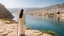 Placeholder: close to the old town of Nazareth, a view on the Lake of Genesareth. a young woman in linen dress, she has her wooden rod she looks at the people down around the shore