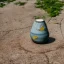 Placeholder: moody artistic photo of a tiny cracked ceramic vase repaired with gold, kintsugi, garden setting, beautiful landscape photography, beautiful, vines and leaves, delicate, cinematic, high detail, beautiful composition, delicate arrangement, aesthetic, soft lighting, award winning photography, tender