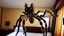 Placeholder: tarantula escaping hotel room while guests scream and run frantically