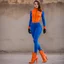 Placeholder: shelby lynga is a secret agent wearing her blue catsuit orange gloves and orange high heel boots