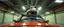 Placeholder: car driving happy 2d fluffy pirate orc fox hippo in the style of Escher and Giger and Fallout 4, pinhole cam, airbrush 3d rendering, on tv screen:A five-second cinematic single take in a clean industrial presentation hall.