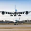 Placeholder: A picture of a plane about to take off from the ground, and the picture was taken from the side of the plane