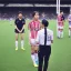 Placeholder: Nahomi Kawasumi in a referee jersey officiating for a soccer match at Wembley Stadium