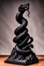 Placeholder: an ominous small statuette made of ebony in the form of a mountain with the snake slithering around the mountain