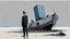 Placeholder: long-legged lean determined black-grey inspectors with beak-shaped heads (wearing white khiton) standing in front of a boat wreck on a radioactive beach, acrylic painting, minimal art, centered, wild sparse brushstrokes, amazing verticals, great parallels, low bleak colors of gray, blue and black, excellent negative space contrasts