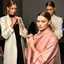 Placeholder: Female fashion models tying knots.
