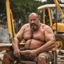 Placeholder: extreme close up photography of a sicilian ugly burly serious wet sweaty, muscular chubby strong fat carpenter, shirtless, boxer, bulge, manly chest, very hairy allover, big goatee 51 years old, short hair, sitting with open legs on a little chair , on a construction site in the middle of a road, under the August sun, emotional eyes, , hyper-realistic, photorealistic , frontal view from the ground