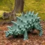 Placeholder: stegosaurus eating leaves