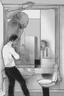Placeholder: a man looking into a shattered bathroom mirror and seeing a horrifying, abstract deranged monster in his reflection