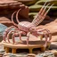 Placeholder: A light pink poison elemental scorpion designed in Navajo baskets painted by Frank Lloyd Wright