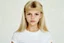 Placeholder: Polaroid, jeune brigitte bardot,, cheveux long blonds sésans frange, yeux marron, petit nez, visage poupin, t-shirt blanc, fond blanc