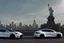 Placeholder: A Tesla 'Model S' is parked, near the 'Statue of Liberty' in New York. CINEMATIC. WIDE ANGLE LENS. PHOTO REAL.