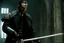 Placeholder: Action shot of Tom Hardy as Father Alexander Anderson from the live action "Hellsing" movie based on the anime of the same name. He is throwing glowing daggers