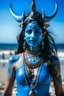 Placeholder: A photo of a blue skin Hindu goddess with painted blue face and body skin, wavy black hair deer antler horns, standing on a sunny beach