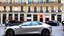 Placeholder: A Tesla's 'Model S Plaid' is parked, at the 'Sacre Coeur', in Paris. CINEMATIC. WIDE ANGLE LENS. PHOTO REAL.