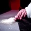 Placeholder: A man sniffing cocaine through rolled dollar paper, cocaine is on table, Close-up to action