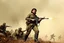 Placeholder: color image of Che Guevara with his real face standing with heavy gun in hand boots in a fighting area, other soldiers are fighting